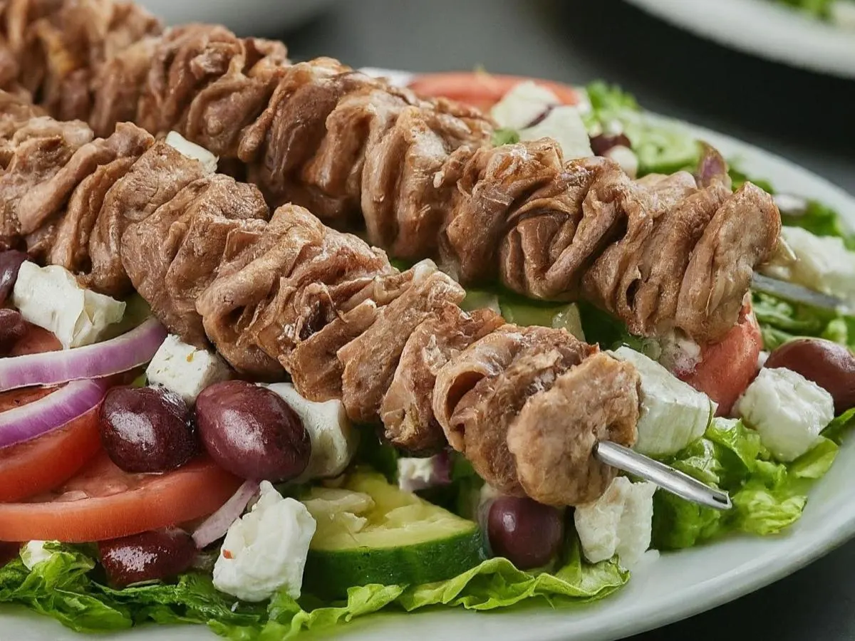 Doner Skewers over Salad with Pita and Hummus