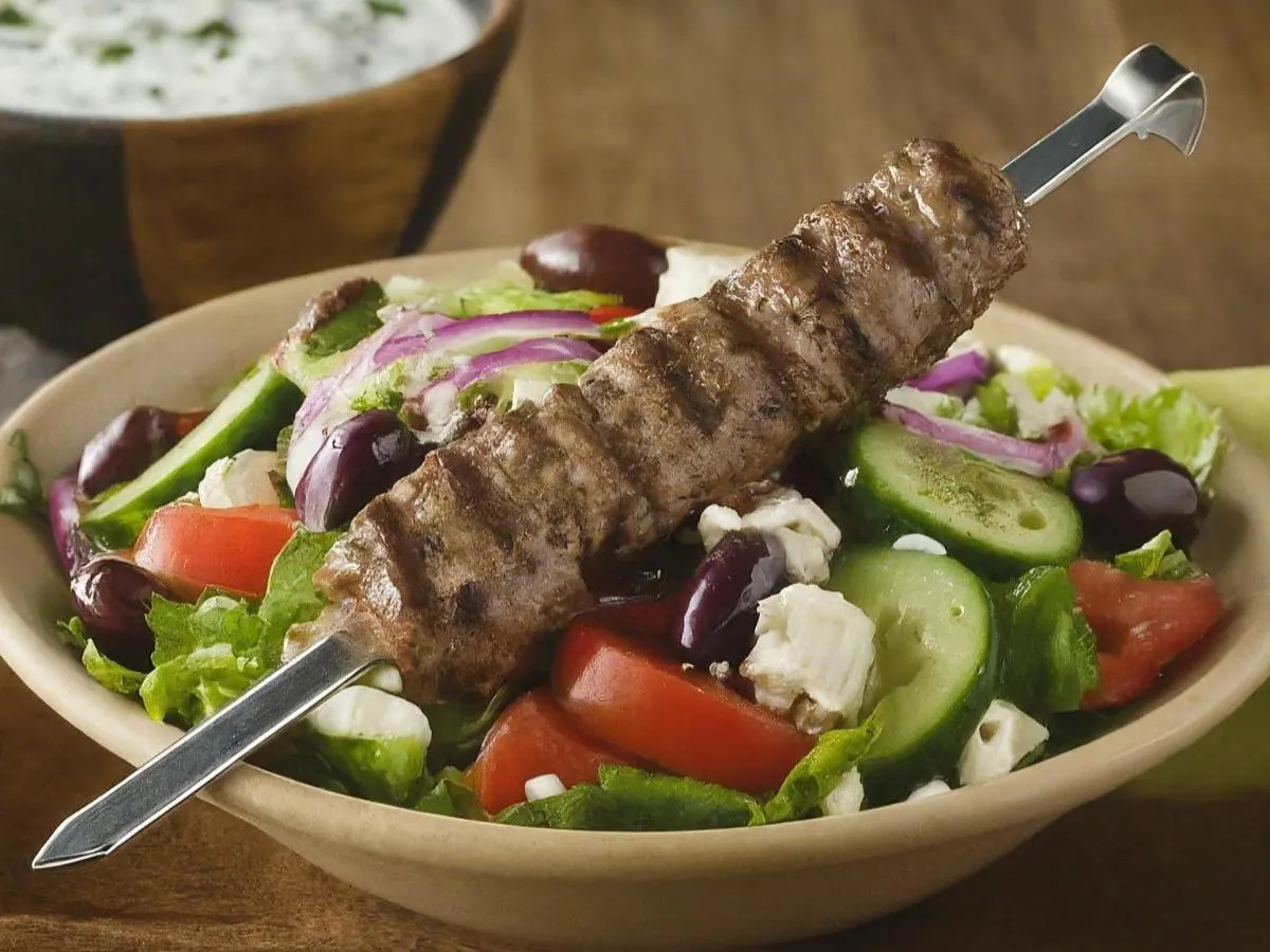 Lamb Skewers over Salad with Pita and Hummus