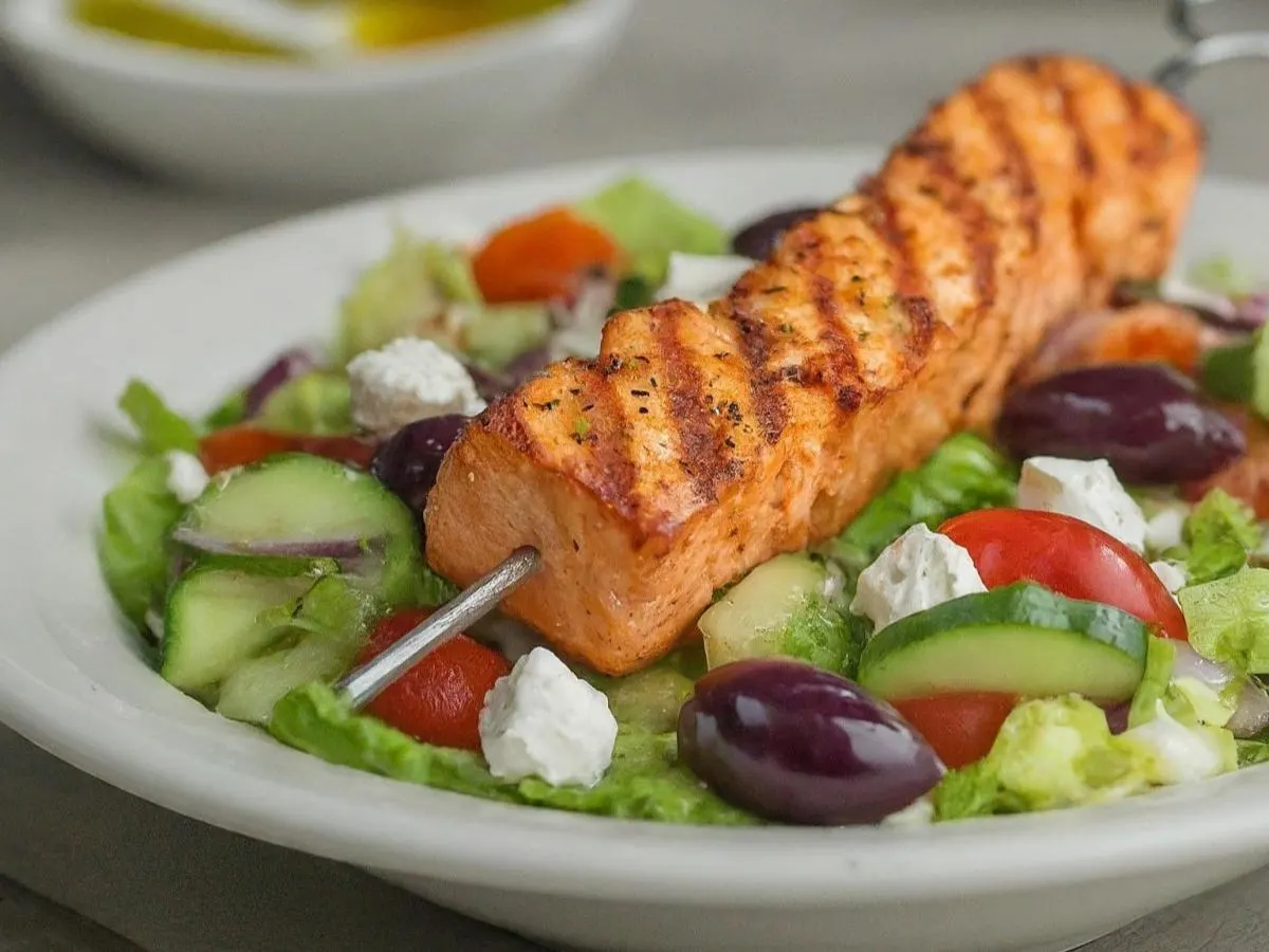 Salmon Skewers over Salad with Pita and Hummus
