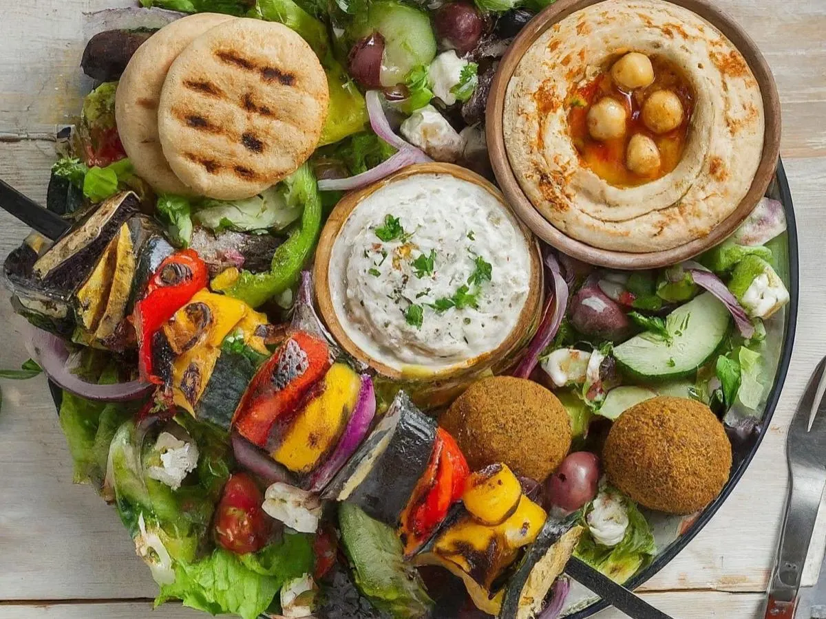 Veggie Skewer over salad with Pita and Hummus