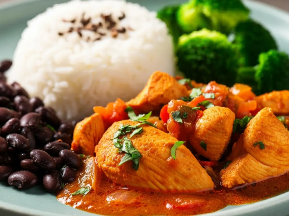 Stewed Chicken with White Rice Mixed with Black Beans and Steamed Broccoli