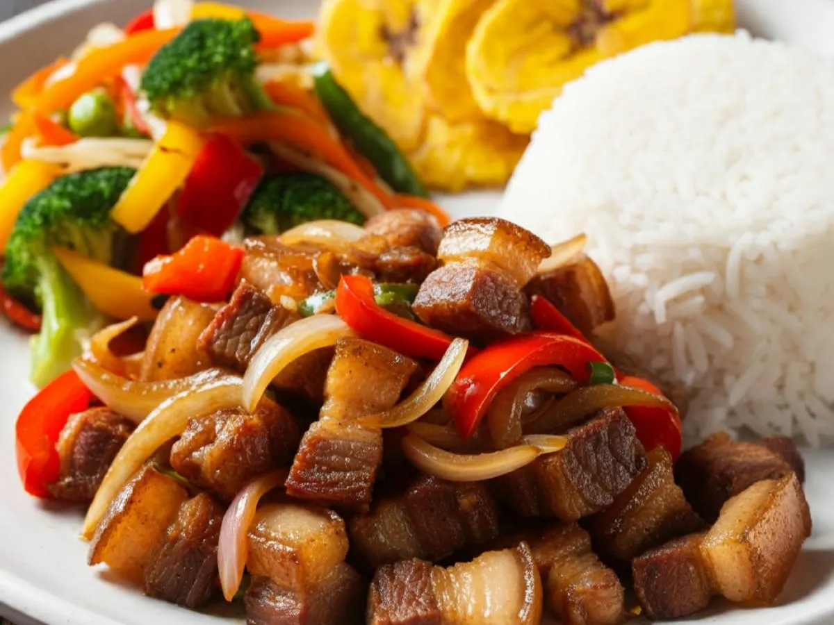 Pork belly sisig with rice and fried plantains and Veggies Pork belly sisig with rice and fried plantains and Veggies