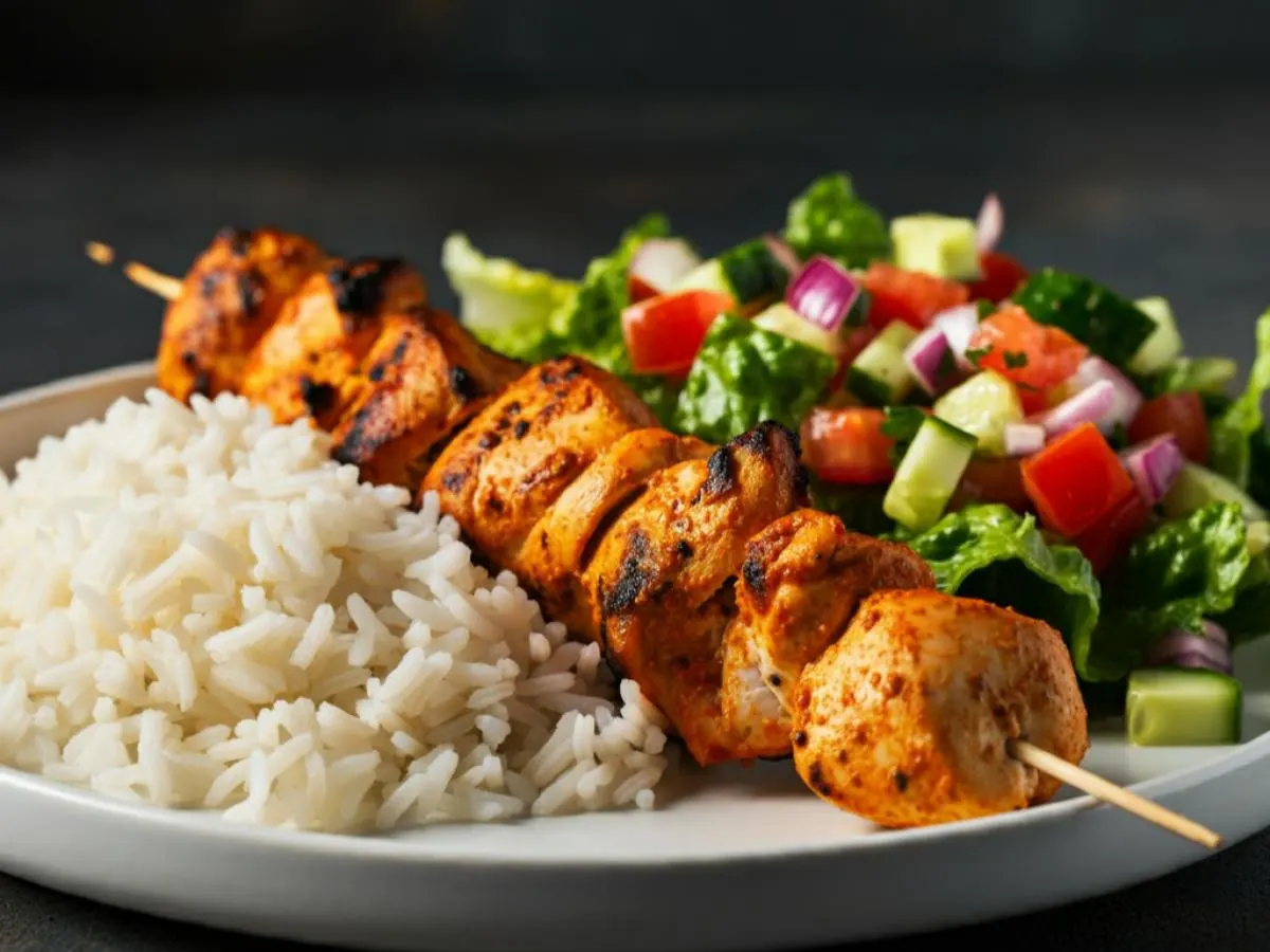 Chicken Kebab Plate with Rice and Mediterranean Salad Chicken Kebab Plate with Rice and Mediterranean Salad
