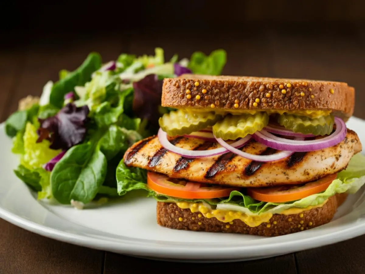 Gluten Free and Dairy Free Grilled Chicken Breast Sandwich and Green Salad Gluten Free and Dairy Free Grilled Chicken Breast Sandwich and Green Salad