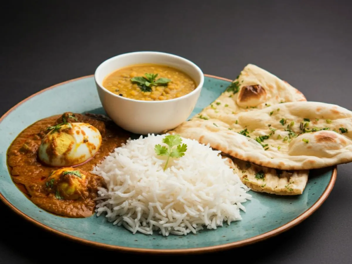 Egg Curry with Dal Tadka, Plain Basmati Rice and Garlic Naan Egg Curry with Dal Tadka, Plain Basmati Rice and Garlic Naan