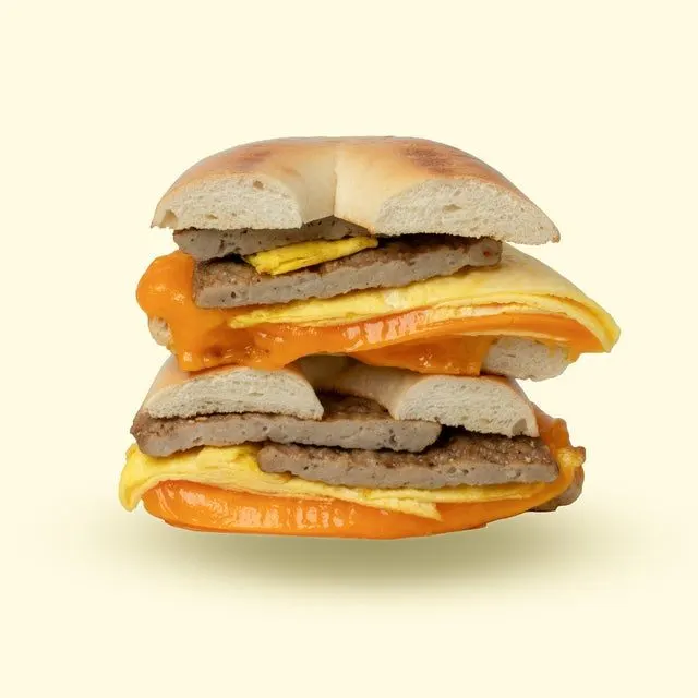 2 Eggs & Cheese with Sausage - on a Sesame Bagel Served With Chips