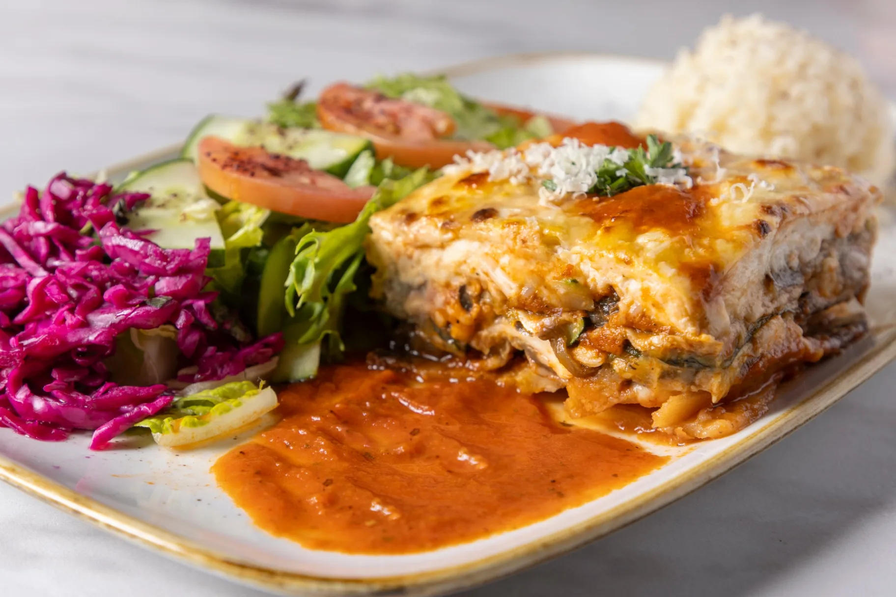 Moussaka served with rice, salad & pita bread (Vegetarian)