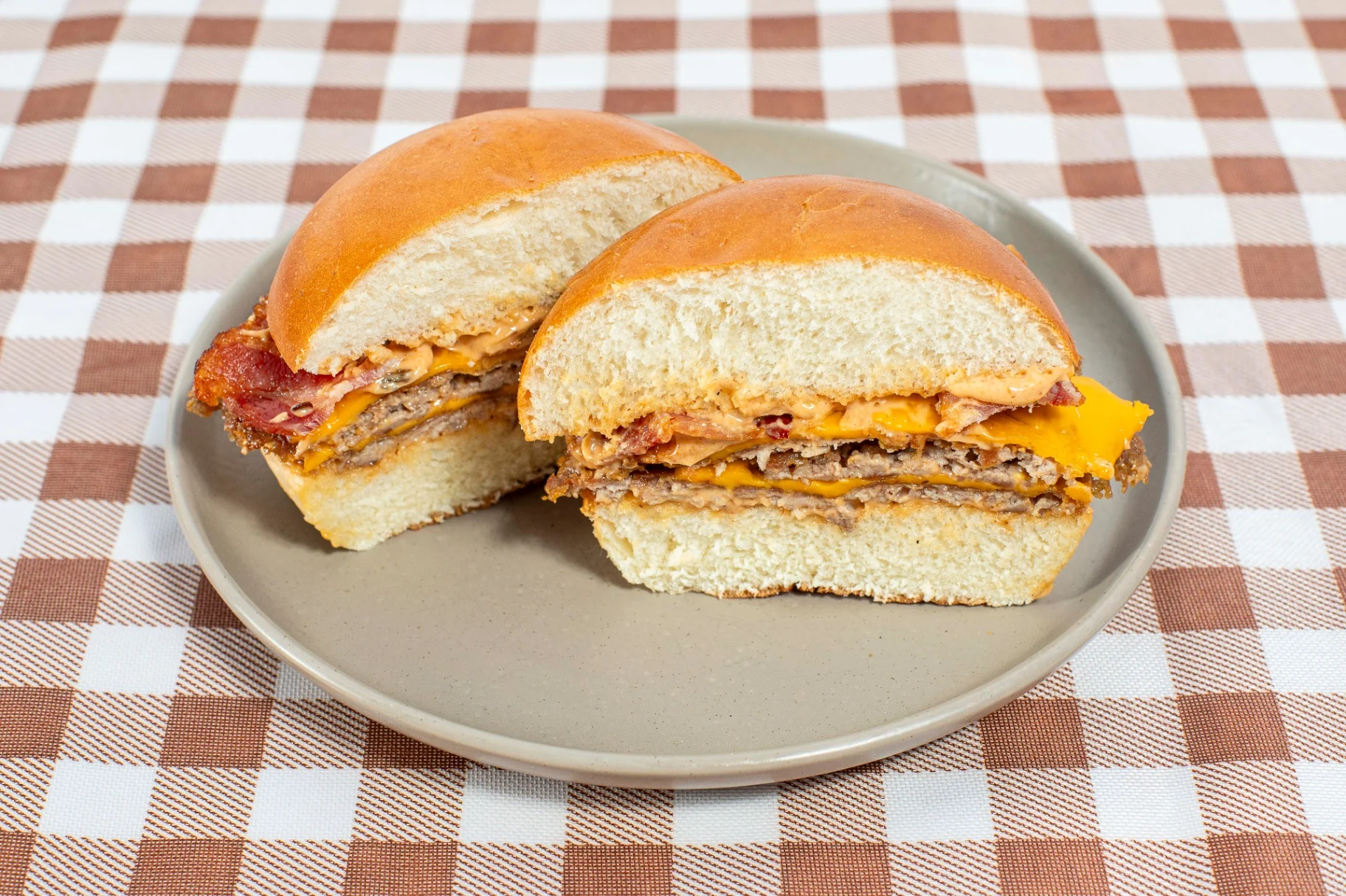 Double Pork Patty Sandwich with Chipotle Sauce, Bacon, Pickles, and Cheese