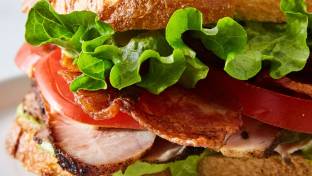 Turkey Club Sandwich with Chips and a Green Salad Turkey Club Sandwich with Chips and a Green Salad