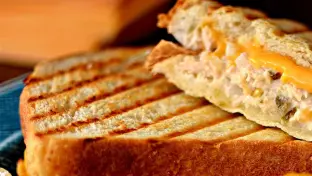 Tuna Melt Panini with Chips and a Green Salad Tuna Melt Panini with Chips and a Green Salad