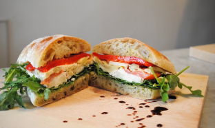 La Phoenician Sandwich with Kettle Potato Chips, a Gala apple and a bag of Stroopwafel La Phoenician Sandwich with Kettle Potato Chips, a Gala apple and a bag of Stroopwafel