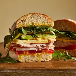 French Club Sandwich with Kettle Potato Chips, a Gala apple and a bag of Stroopwafel French Club Sandwich with Kettle Potato Chips, a Gala apple and a bag of Stroopwafel