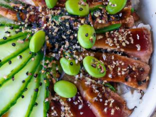 Regular Ahi Tuna over White Rice with Cucumber, Edamame, Cilantro, Green Onion, Sesame Seeds, Shredded Nori, and Garlic Crisps Regular Ahi Tuna over White Rice with Cucumber, Edamame, Cilantro, Green Onion, Sesame Seeds, Shredded Nori, and Garlic Crisps