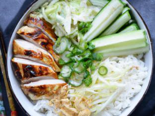 Grilled Chicken, Rice, Cucumber, Onion, Cabbage, Cilantro, Ginger & Garlic Crisps Grilled Chicken, Rice, Cucumber, Onion, Cabbage, Cilantro, Ginger & Garlic Crisps