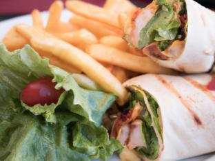 Crispy Chicken BLT Wrap with Chips and a Green Salad Crispy Chicken BLT Wrap with Chips and a Green Salad