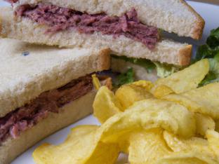 Corned Beef Sandwich with Chips and a Green Salad Corned Beef Sandwich with Chips and a Green Salad
