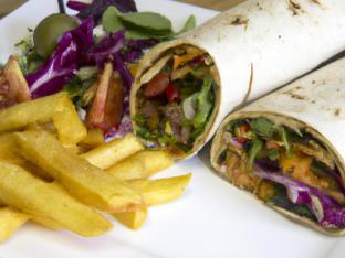 Vegan Grilled Vegetable Wrap with Chips and a Green Salad Vegan Grilled Vegetable Wrap with Chips and a Green Salad