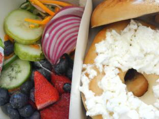 Onion Bagel with Cream Cheese and Fruit Salad Onion Bagel with Cream Cheese and Fruit Salad