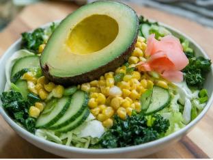 Regular Avocado bowl over Salad with Cucumber, Cabbage, Raw Kale, Sweet Corn, Pickled Ginger, and Green Onion