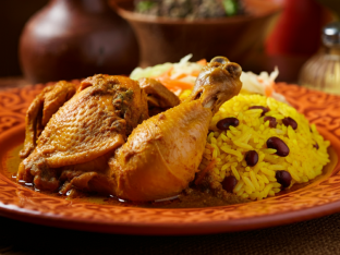 Stewed Chicken with Yellow Rice Mixed with Pigeon Peas and Cabbage