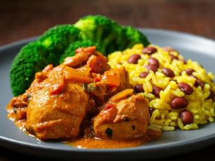 Stewed Chicken with Yellow Rice Mixed with Pigeon Peas and Steamed Broccoli