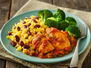 Stewed Chicken with Yellow Rice Mixed with Pinto Beans and Steamed Broccoli