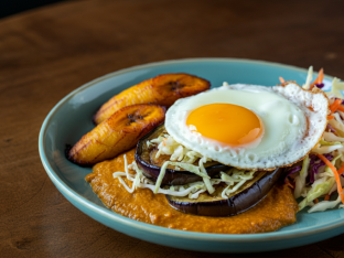 Roasted Eggplant in Coconut Sauce with Egg, Sweet Plantains and Cabbage