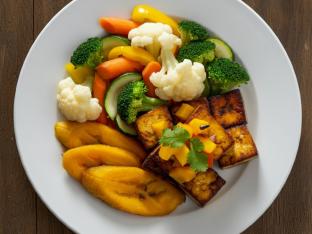 Tropical Mango Tofu with Sweet Plantains and Steamed Seasonal Vegetables
