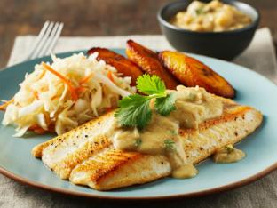 Tilapia with side of Coconut Sauce with Sweet Plantains and Cabbage