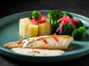 Tilapia with side of Coconut Sauce with Yuca with Pickled Onions & Broccoli