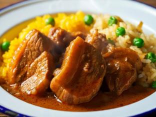 Stewed Pork with Yellow Rice Mixed with Pigeon Peas and Cabbage
