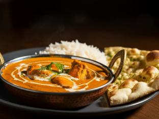 Butter Chicken with Chana Masala, Basmati Rice, and Garlic Naan Butter Chicken with Chana Masala, Basmati Rice, and Garlic Naan