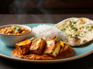 Paneer Tikka Masala with Chana Masala, Basmati Rice, and Garlic Naan Paneer Tikka Masala with Chana Masala, Basmati Rice, and Garlic Naan