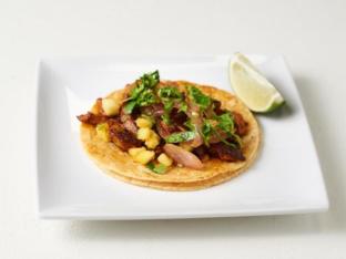 Al Pastor Tacos on Corn Tortilla Mexican Style with Black Beans Plate Al Pastor Tacos on Corn Tortilla Mexican Style with Black Beans Plate