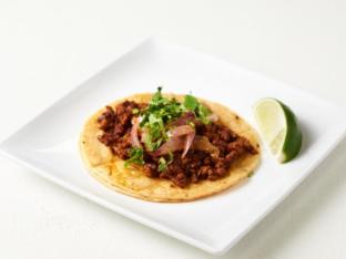 Chorizo Tacos on Corn Tortilla, Mexican Style with Refried Beans Plate Chorizo Tacos on Corn Tortilla, Mexican Style with Refried Beans Plate