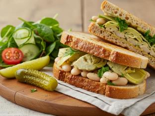 Vegan Gluten Free Artichoke & White Bean Sandwich With Side Salad and a Pickle Spear Vegan Gluten Free Artichoke & White Bean Sandwich With Side Salad and a Pickle Spear