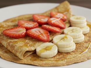 Vegan and Gluten Free Crepe with Strawberry, Banana and Sugar Icing Vegan and Gluten Free Crepe with Strawberry, Banana and Sugar Icing