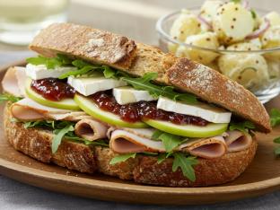Turkey and Brie Sandwich on Sourdough with potato salad Turkey and Brie Sandwich on Sourdough with potato salad