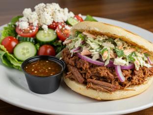 Pulled Pork Arepa Boxed Meal with Greek Salad Pulled Pork Arepa Boxed Meal with Greek Salad