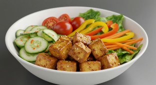 Vegan Tofu Teriyaki with marinated cucumber salad and mixed greens