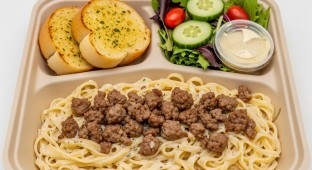 Fettuccine Alfredo With Italian Sausage with a House Salad and Garlic Bread