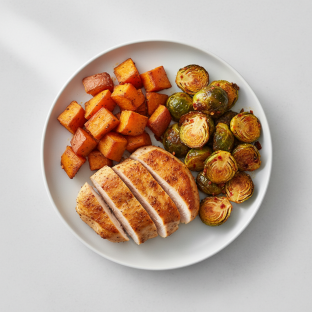 Provencal Style Chicken Served with Roasted Sweet Potato & Chili Crisp Brussels Sprouts