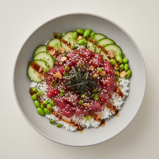Large Ahi Tuna over White Rice with Cucumber, Edamame, Cilantro, Green Onion, Sesame Seeds, Shredded Nori, and Garlic Crisps Large Ahi Tuna over White Rice with Cucumber, Edamame, Cilantro, Green Onion, Sesame Seeds, Shredded Nori, and Garlic Crisps