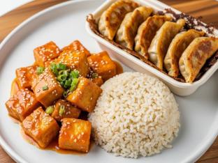 Orange Sauteed Tofu with Steamed Brown Rice and Chicken Potstickers