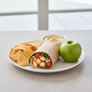 Texas Buffalo Wrap Lunch with Pita Chips, Hummus, and a Green Apple