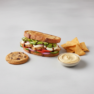 Chicken Mozzarella on Sourdough, Pita Chips, Hummus, Chocolate Chip Cookie