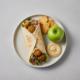 Vegan Falafel Wrap Lunch with Pita Chips, Hummus, and a Green Apple