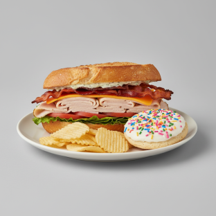 Turkey and Bacon Club Sandwich With Potato Chips and Sprinkle Sugar Cookie