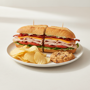 Turkey and Bacon Club Sandwich With Potato Chips and Cowboy Cookie