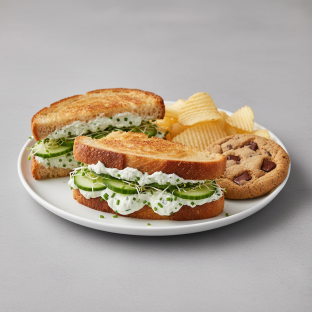 Cucumber Cream Cheese Sandwich With Potato Chips and Chocolate Chip Cookie
